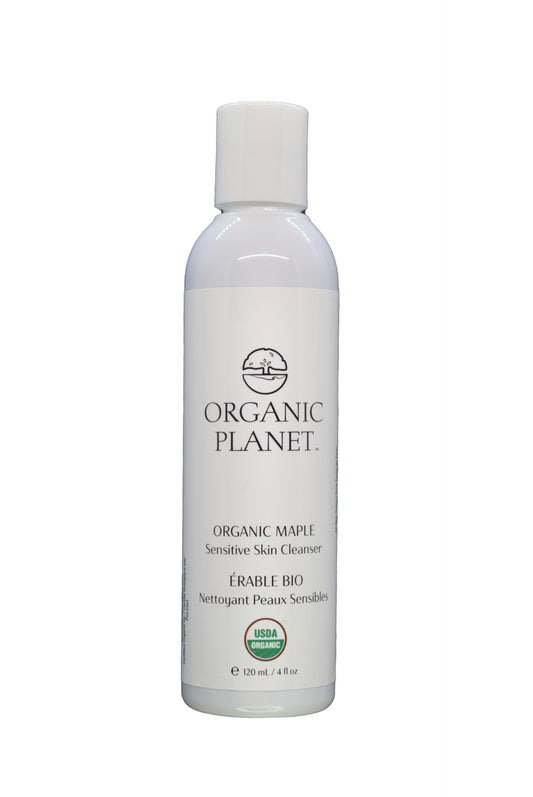 White bottle of Organic Planet organic maple cleanser on a white background