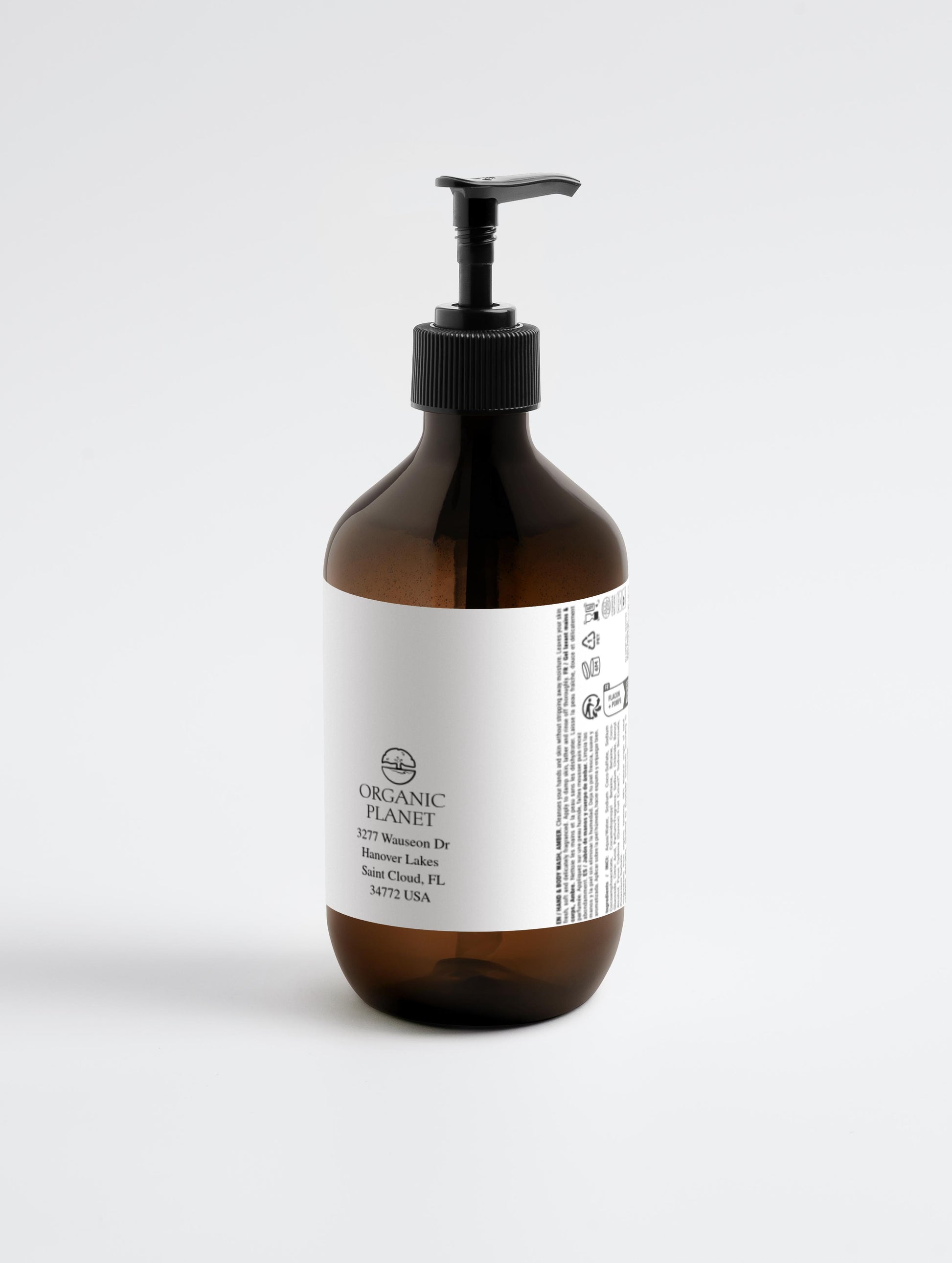 Brown bottle with pump and white label on a light gray background.