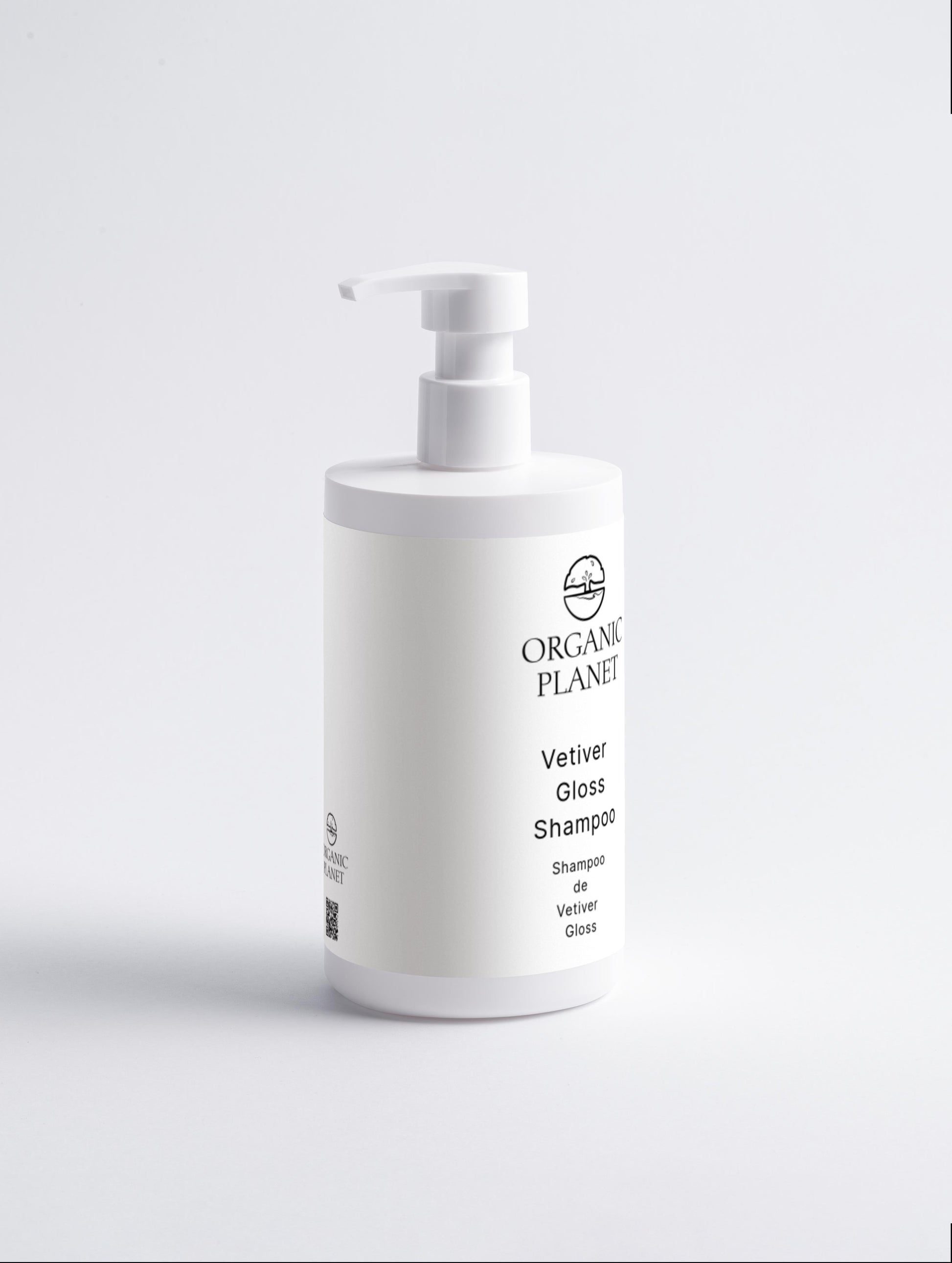 White shampoo bottle with pump on a light gray background. Vetiver Gloss Shampoo gently cleanses and nourishes hair, leaving it smooth, shiny, and healthy. Infused with vetiver oil, glycerin, and squalane, it hydrates and strengthens hair while soothing the scalp. Suitable for all skin types.