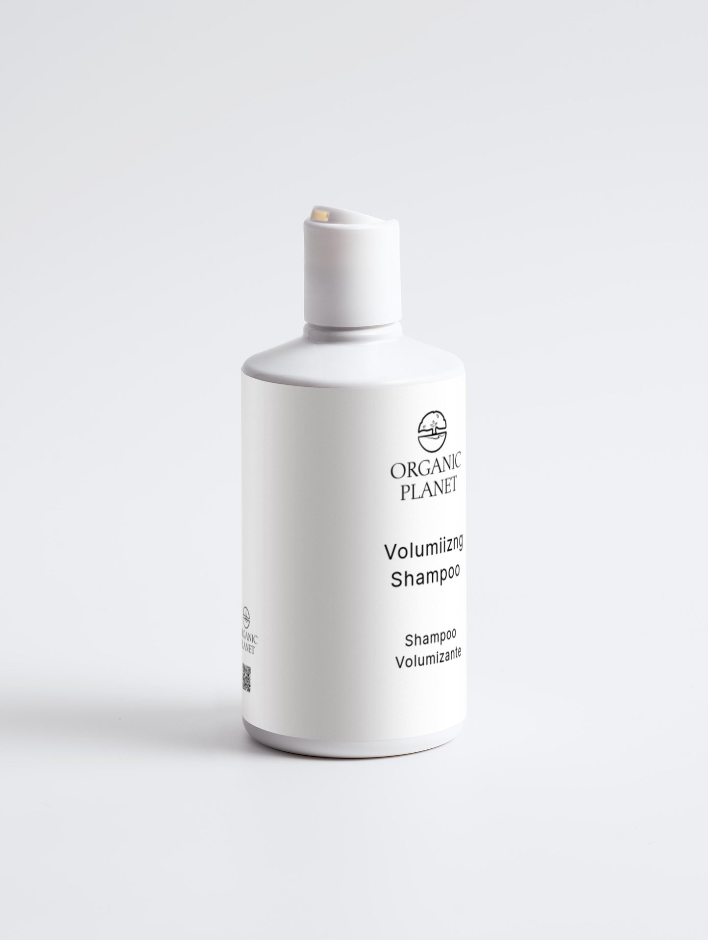 White shampoo bottle labeled 'Organic Planet' on a light gray background. This volumizing shampoo gently cleans hair, keeping it soft and full. Hydrolysed Wheat Protein strengthens strands and adds volume, while Glycerin, Betaine, and Xylitol provide moisture and conditioning. Mild surfactants clean effectively, and lightweight conditioners boost volume without heaviness.