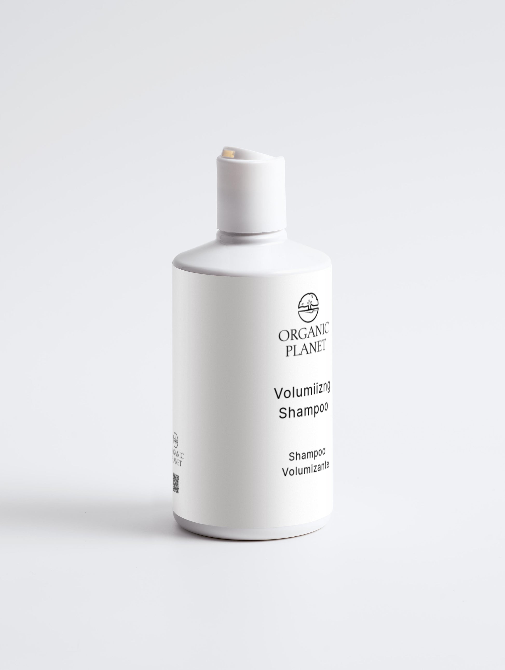 White shampoo bottle labeled 'Organic Planet' on a light gray background. This volumizing shampoo gently cleans hair, keeping it soft and full. Hydrolysed Wheat Protein strengthens strands and adds volume, while Glycerin, Betaine, and Xylitol provide moisture and conditioning. Mild surfactants clean effectively, and lightweight conditioners boost volume without heaviness.